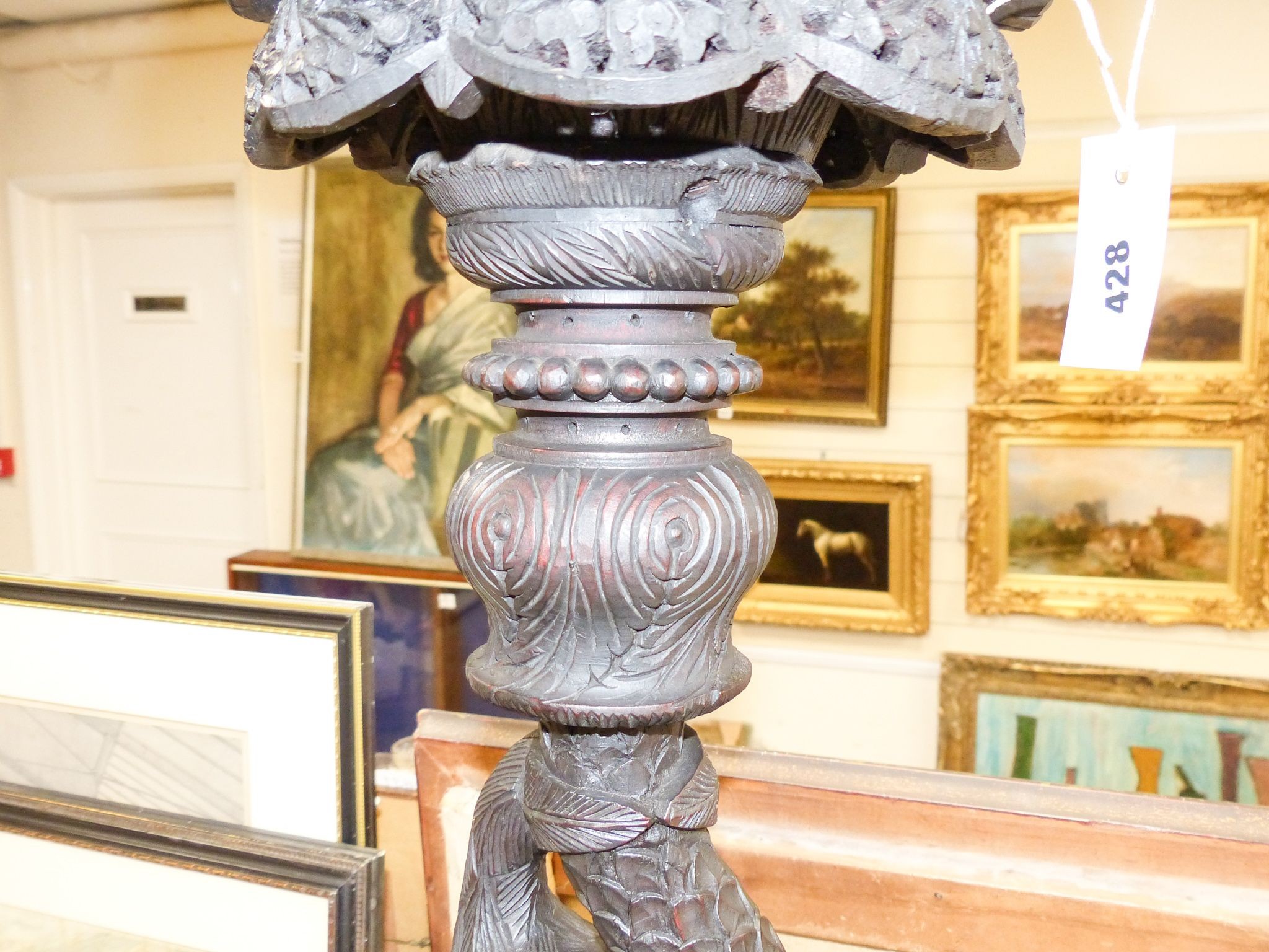 A 19th century Burmese carved hardwood stand 89cm